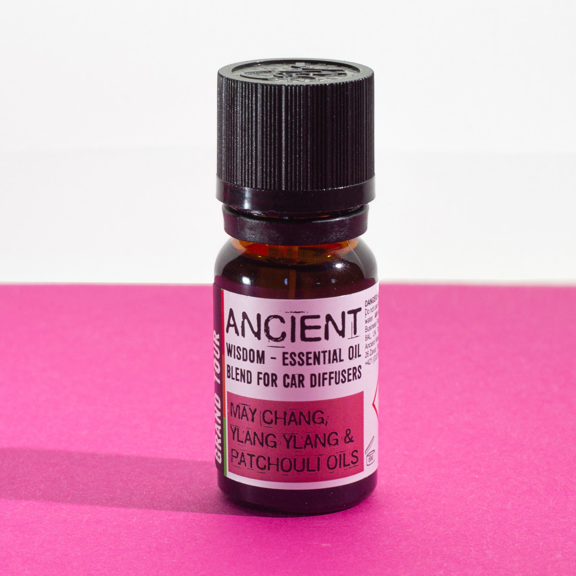 Frasco de aceite esencial para difusor de coche buen viaje 10 ml junto a un difusor circular
