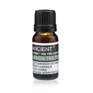 Frasco de aceite esencial de limón y árbol de té sobre fondo blanco
