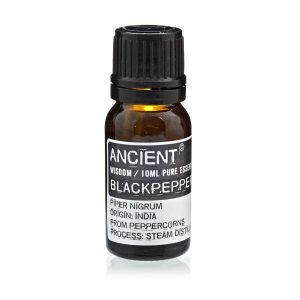 Frasco de aceite esencial de pimienta negra sobre fondo blanco